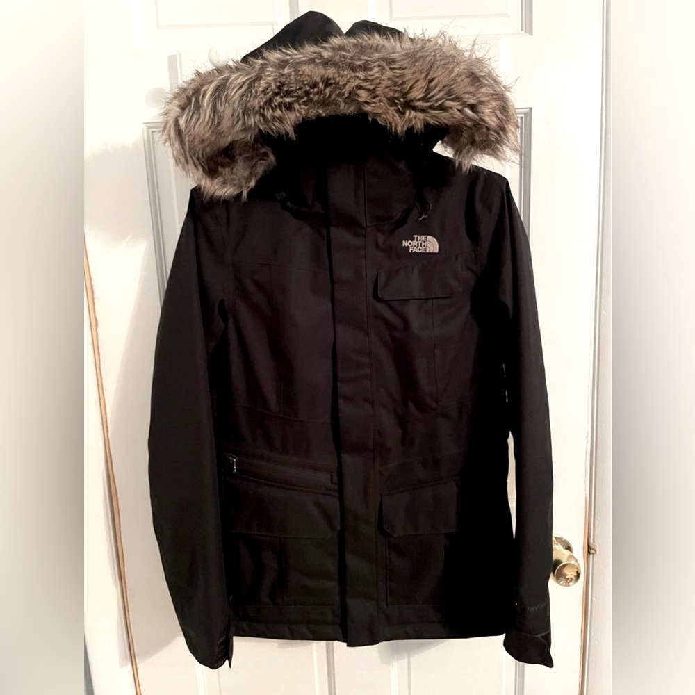 Women’s XS black north face parka with removable faux hood. Like new..Worn once